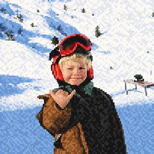 Winkuvi, a pixel-art skier with red goggles, winking and making a shaka hand gesture